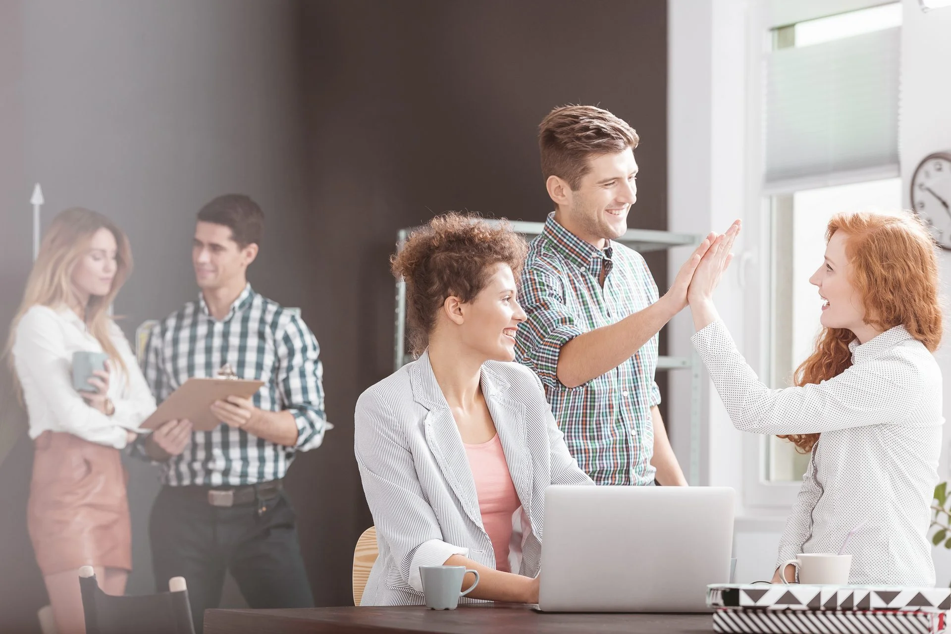 People working in positive environment, woman using laptop